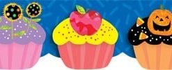 A cupcake with an apple on top of it.