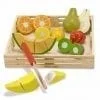 A wooden tray with cut up fruit on it