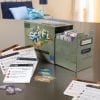 A table with some cards and boxes on it