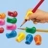 A person using a pencil to draw on candy.