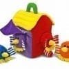 A colorful bird house with two birds sitting on it.