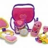 A pink and purple Pretty Purse Fill and Spill Toddler Toy bag with a heart shaped (Pretty Purse Fill and Spill) toy inside.