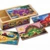A wooden box with four different pictures of dinosaurs.
