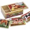 A wooden box with four farm animals puzzles.