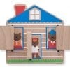 A wooden house with three bears inside of it.
