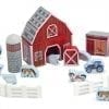 A red barn with many farm animals and buildings.