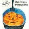 A picture of pancakes in the shape of a smiley face.