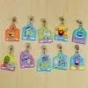 A bunch of different character tags hanging on the wall