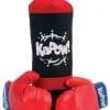 A red punching bag with boxing gloves on top of it.