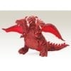 A red dragon toy sitting on top of a white table.