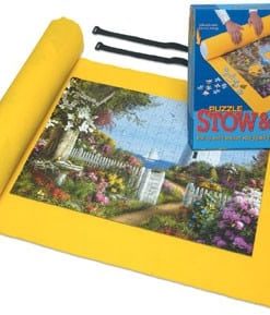 A yellow mat with a box of puzzle pieces on top