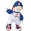 A stuffed baseball player doll wearing blue and white outfit.