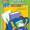 Green grammar workbook cover with school supplies