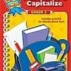 A book cover with a red spiral notebook and pencils.