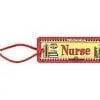 A red and yellow nurse tag with books on it.